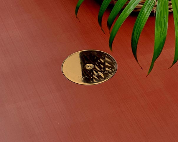 Floor outlet with polished brass cover for bars, yachts, lounges